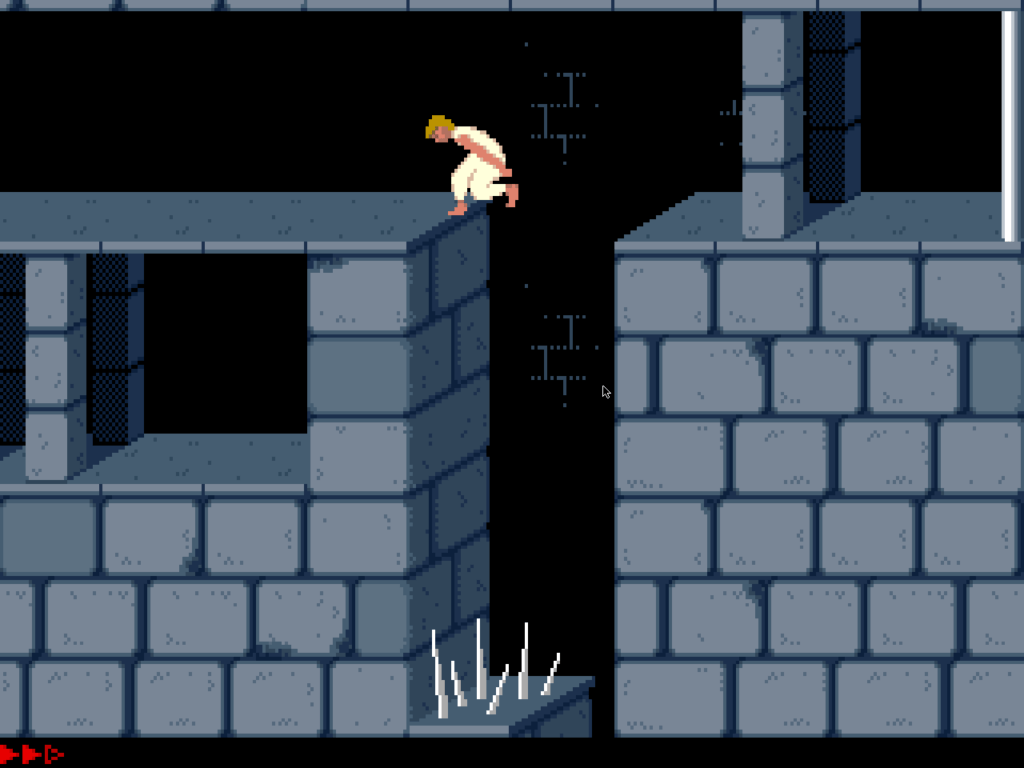 Prince of Persia DOS avec des pièges et des pics dans un niveau de donjon.