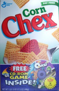 Couverture et boite de céréales contenant Chex Quest
