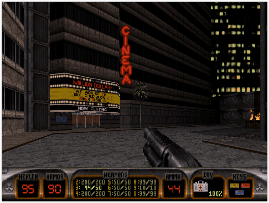 Premier niveau de Duke Nukem 3D sur DOS avec décor urbain et cinéma