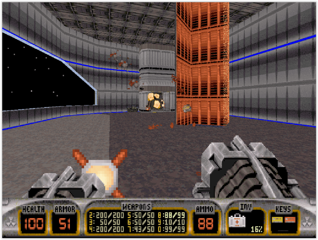 Duke Nukem 3D sur DOS avec arme en vue subjective et ennemi alien